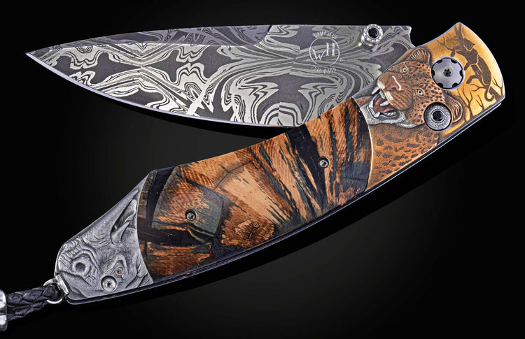 Ornate folding knife with Damascus blade, engraved leopard head, striped wood, and carved rhino pommel.