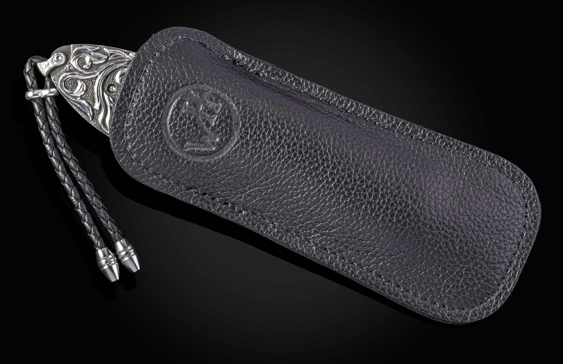 William Henry knife with hand carved sterling silver scales and damascus steel.