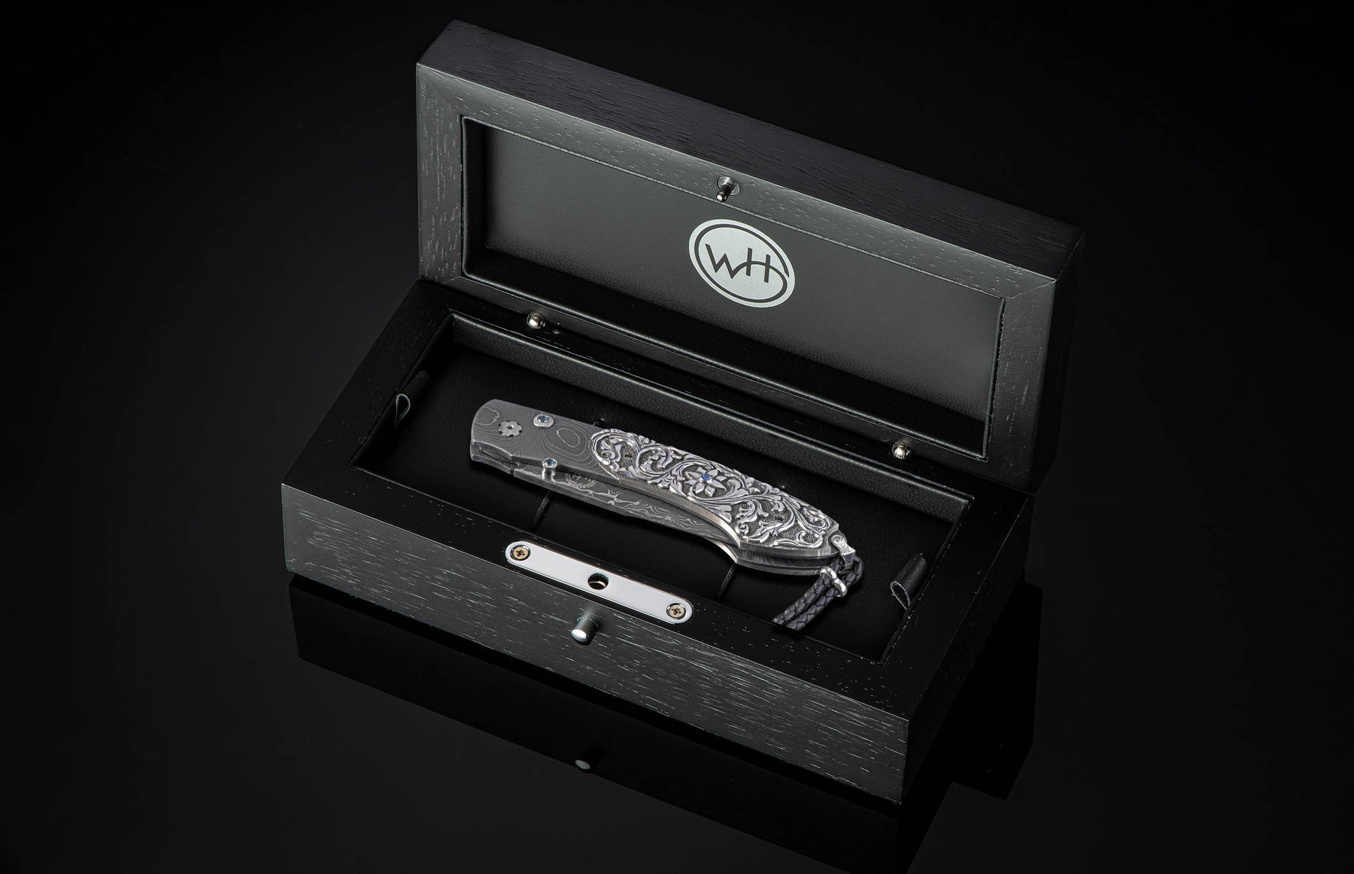 William Henry knife with hand carved sterling silver scales and damascus steel.