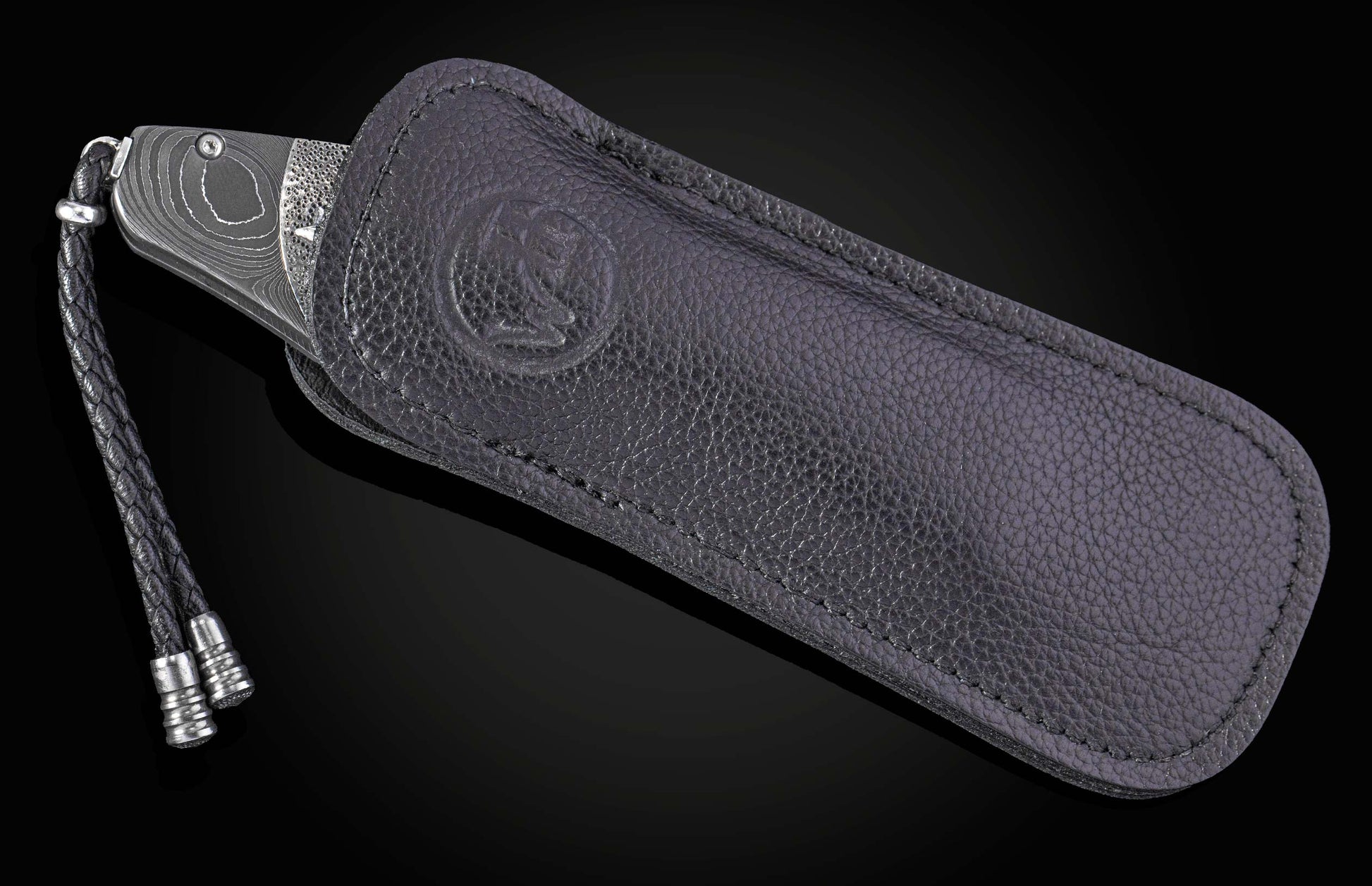 William Henry folding knife with damascus steel and hand carved sterling silver buffalo design