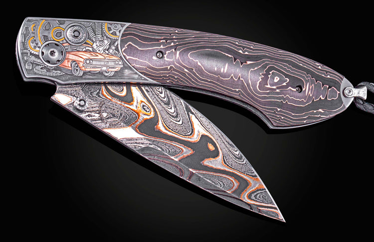 Folding knife with a swirled damascus blade, one side engraved with an orange classic car and gears, the other a dark handle with a swirling pattern.