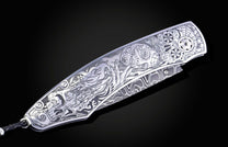 Decorative knife with intricate patterns on a dark background