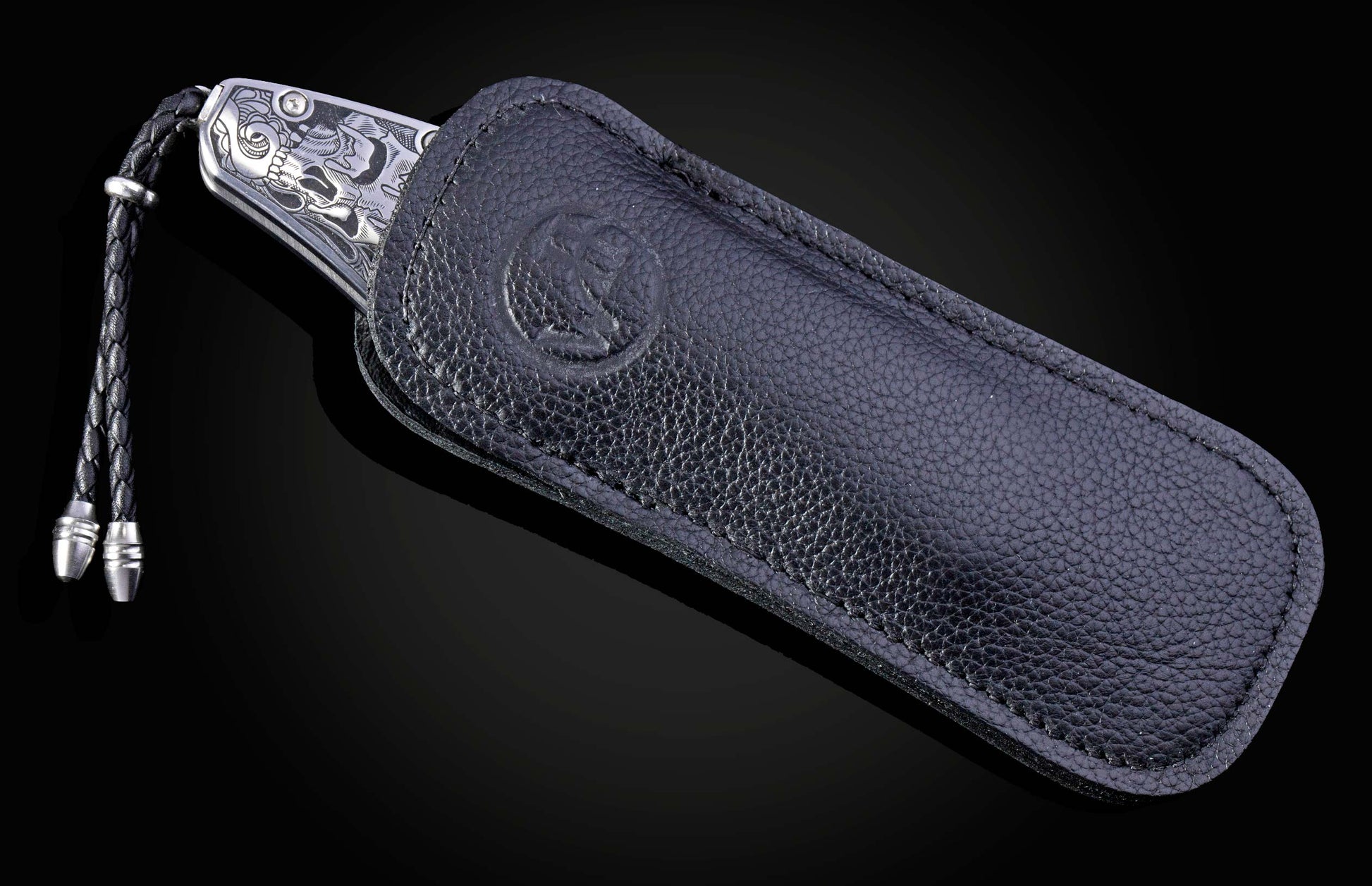 Decorative knife with intricate patterns on a dark background