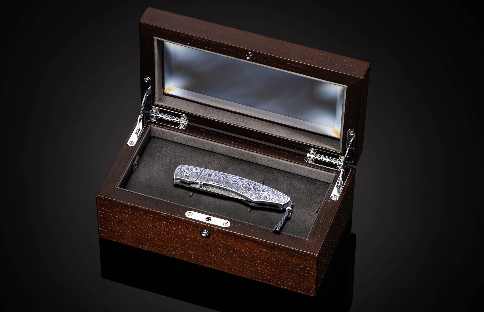 Decorative knife with intricate patterns on a dark background