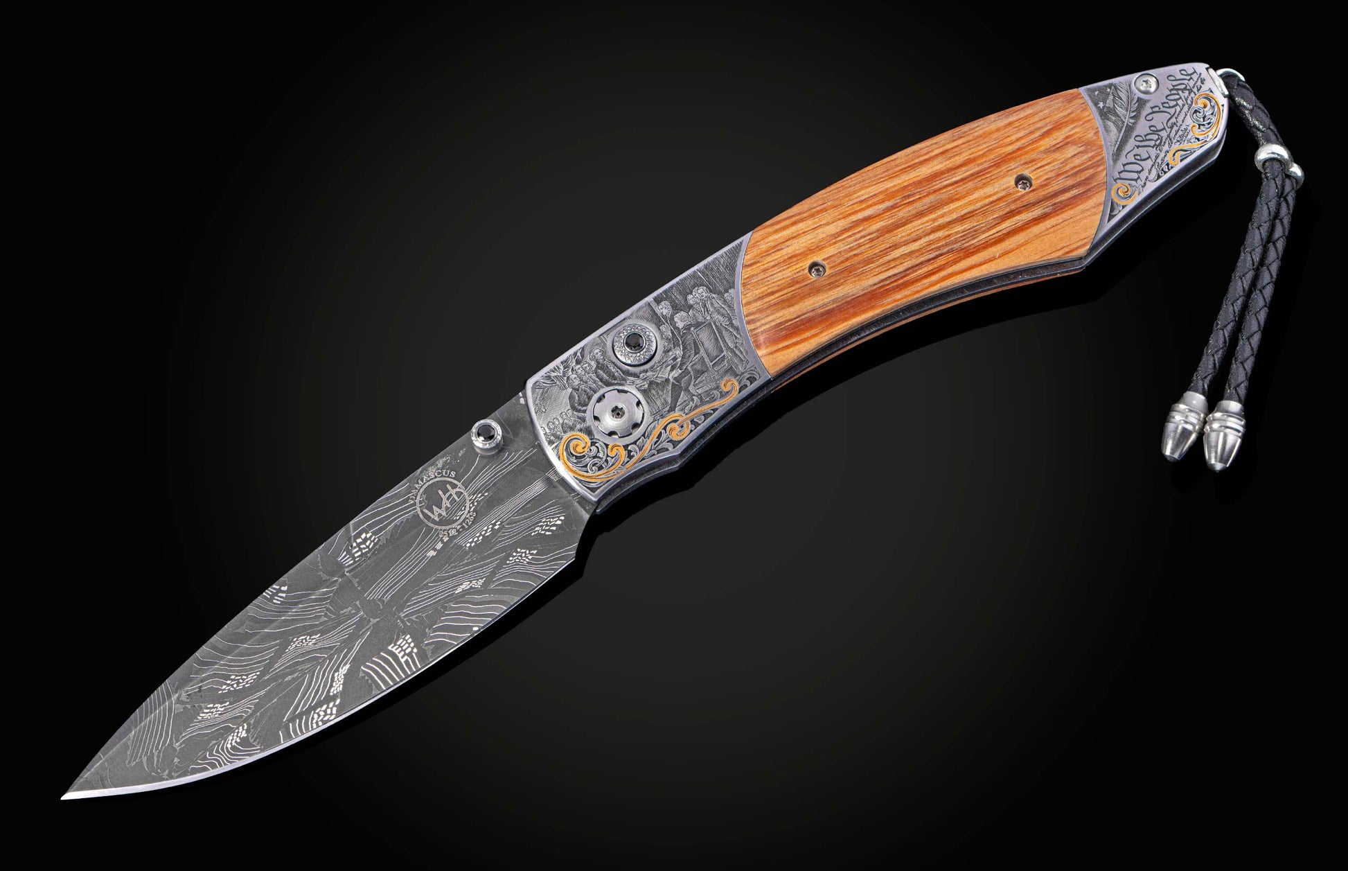 Folding knife with wood handle and intricate hand engraving of historical event. Knife shown open.