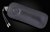 knife in a black leather case