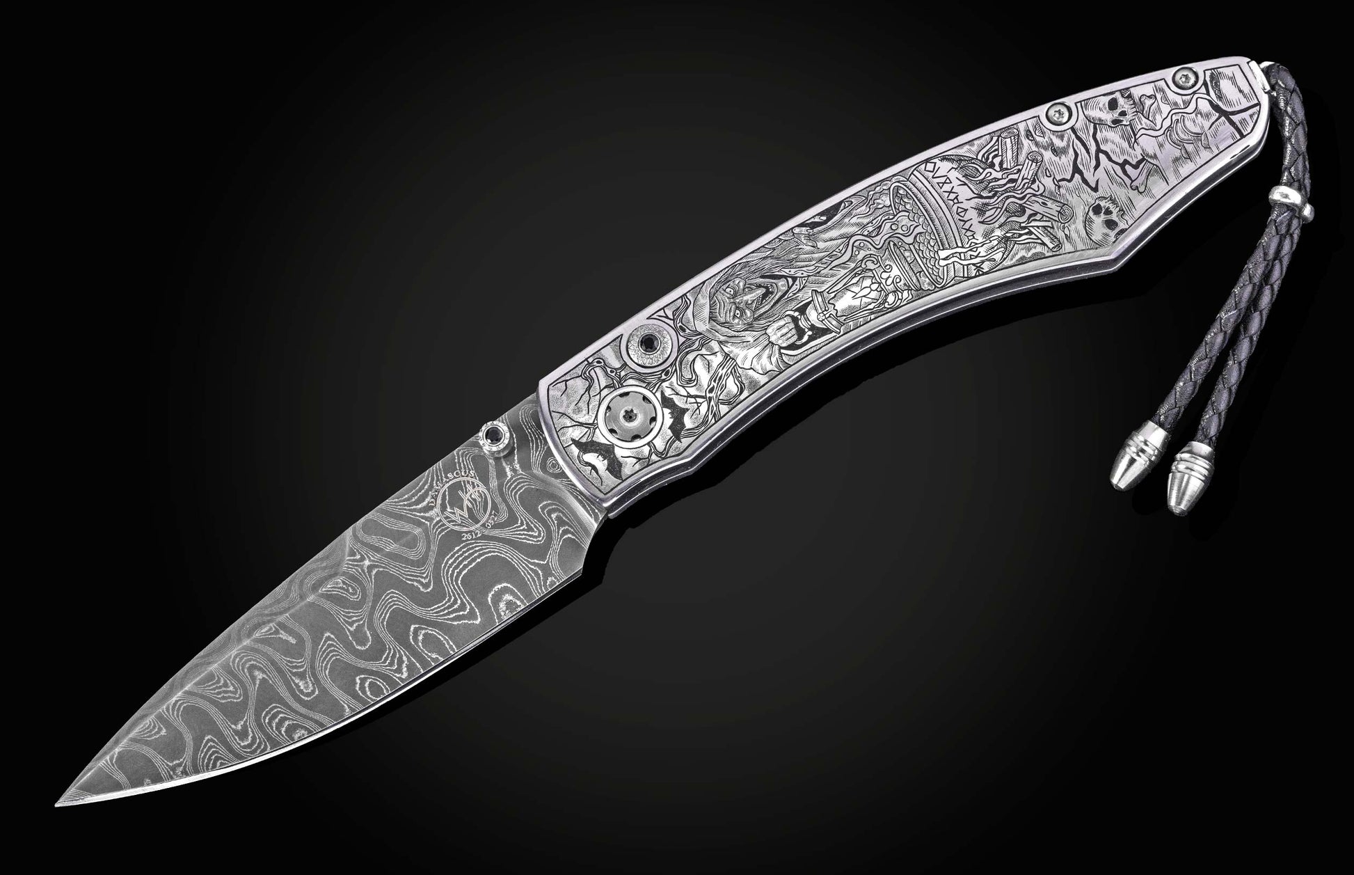 Luxury damascus steel knife with intricate Halloween-themed engravings on silver handle, featuring braided cord and polished hardware, side view on black background