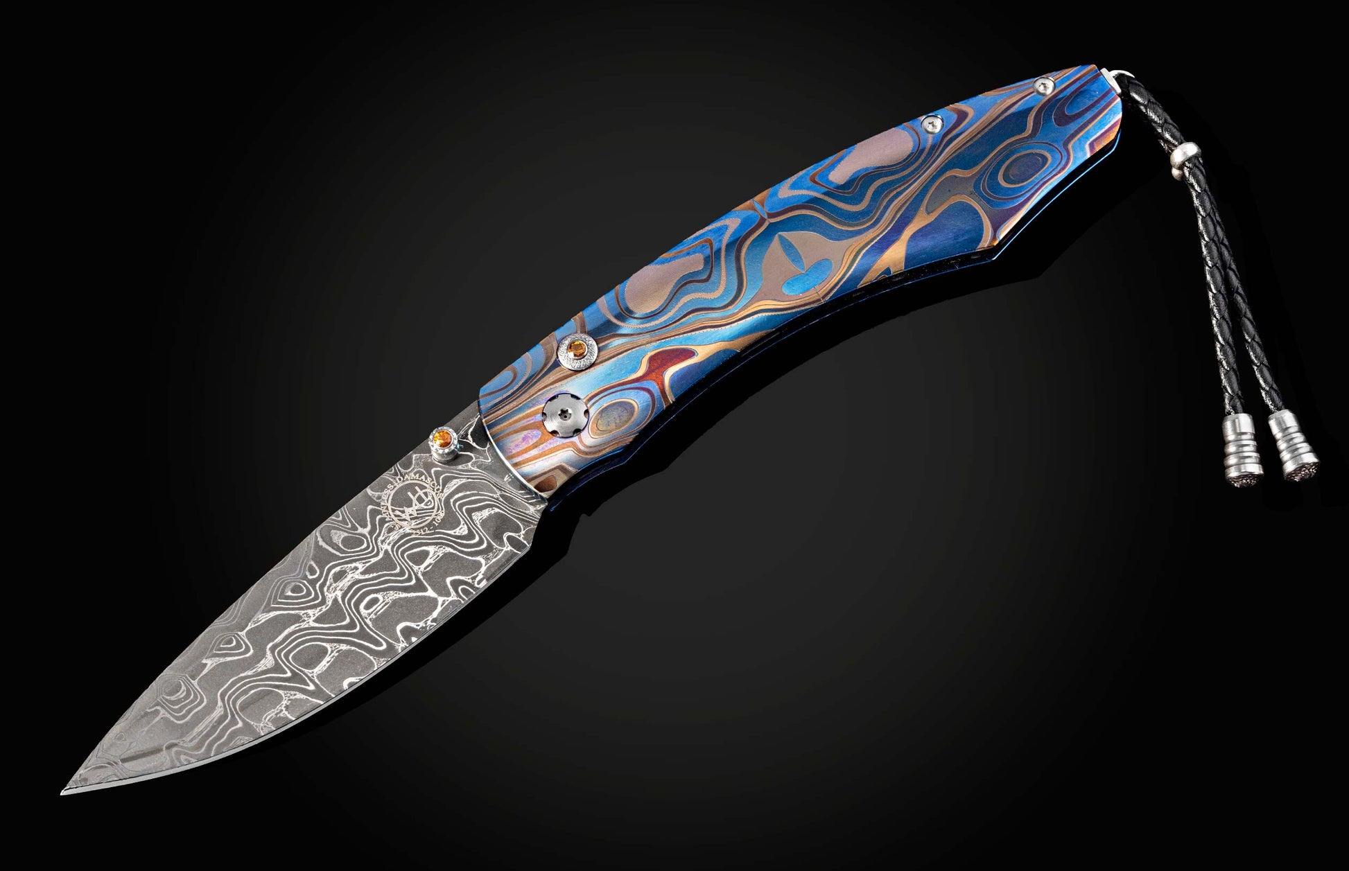 Folding knife with a decorative handle on a black background