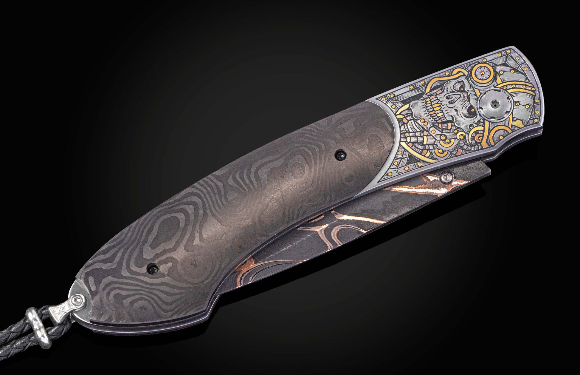 Decorative folding knife with intricate hand engraved skull and gold inlays on a black backgroud