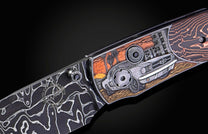 Folding knife with Damascus steel blade and hand engravings on a black background