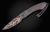 Folding knife with Damascus blade and black handle on a dark background