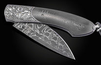 Hand engraved William Henry knife with carbon fiber and damascus steel