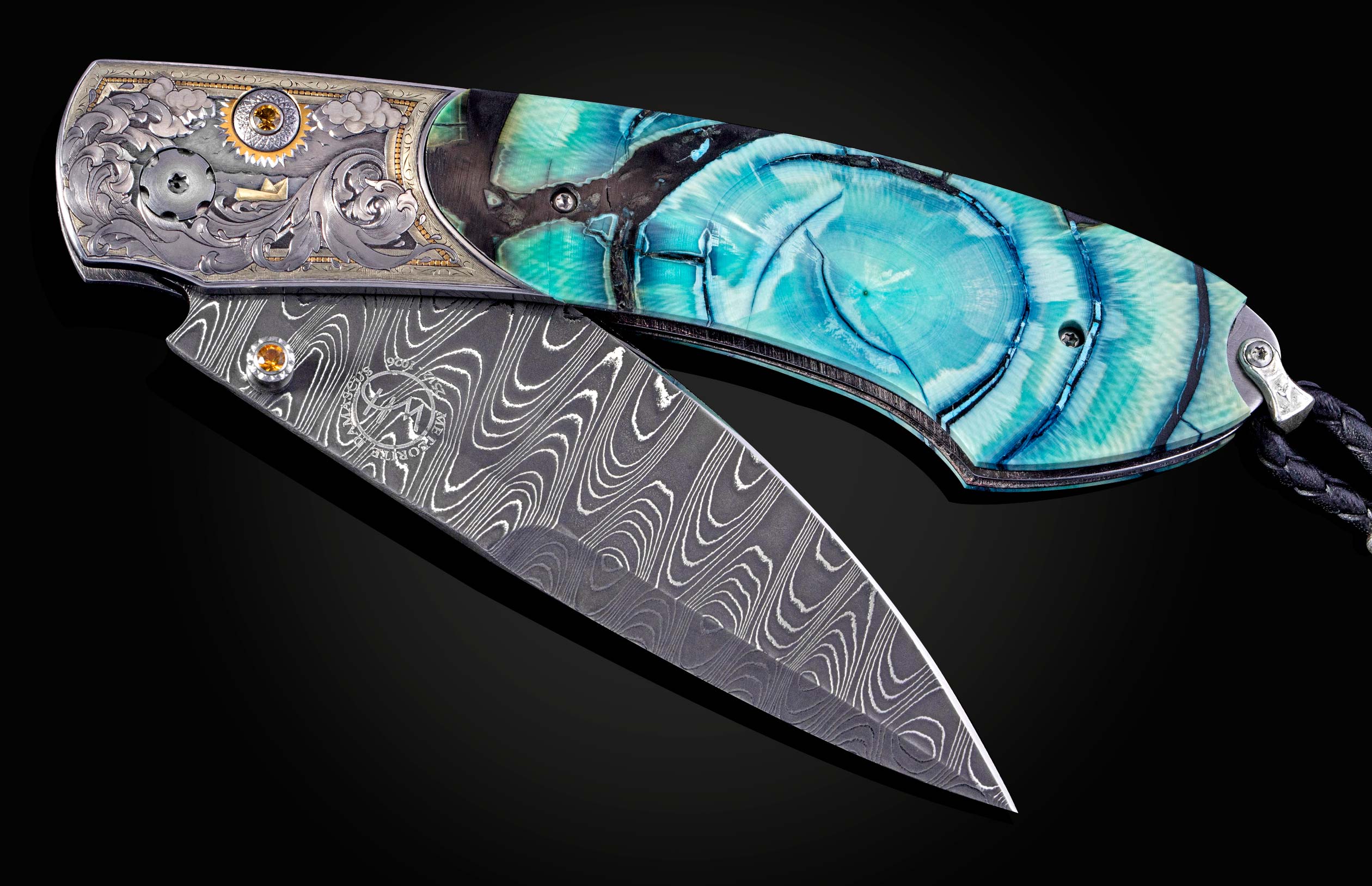 Folding knife with decorative handle and blade on a dark background