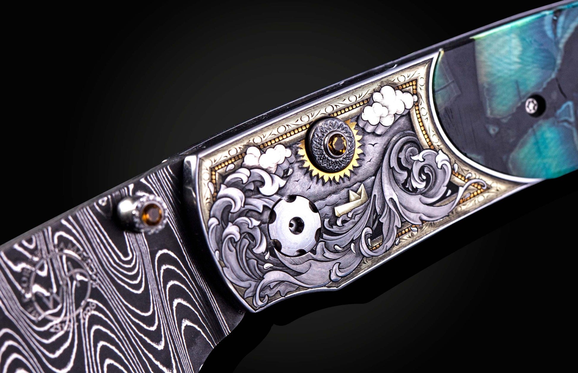 Decorative knife handle with intricate patterns and colors on a dark background