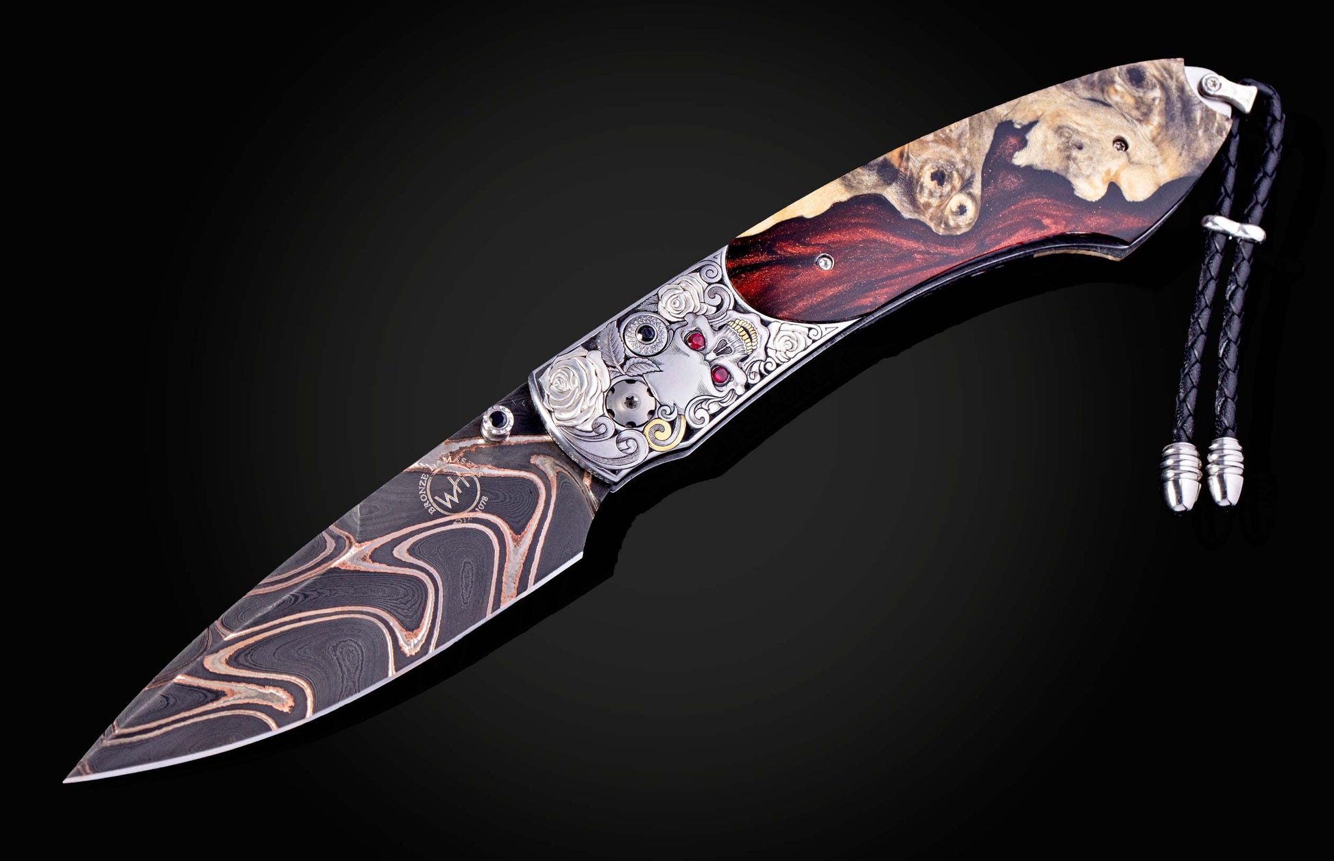 Decorative knife with artistic handle design on a black background