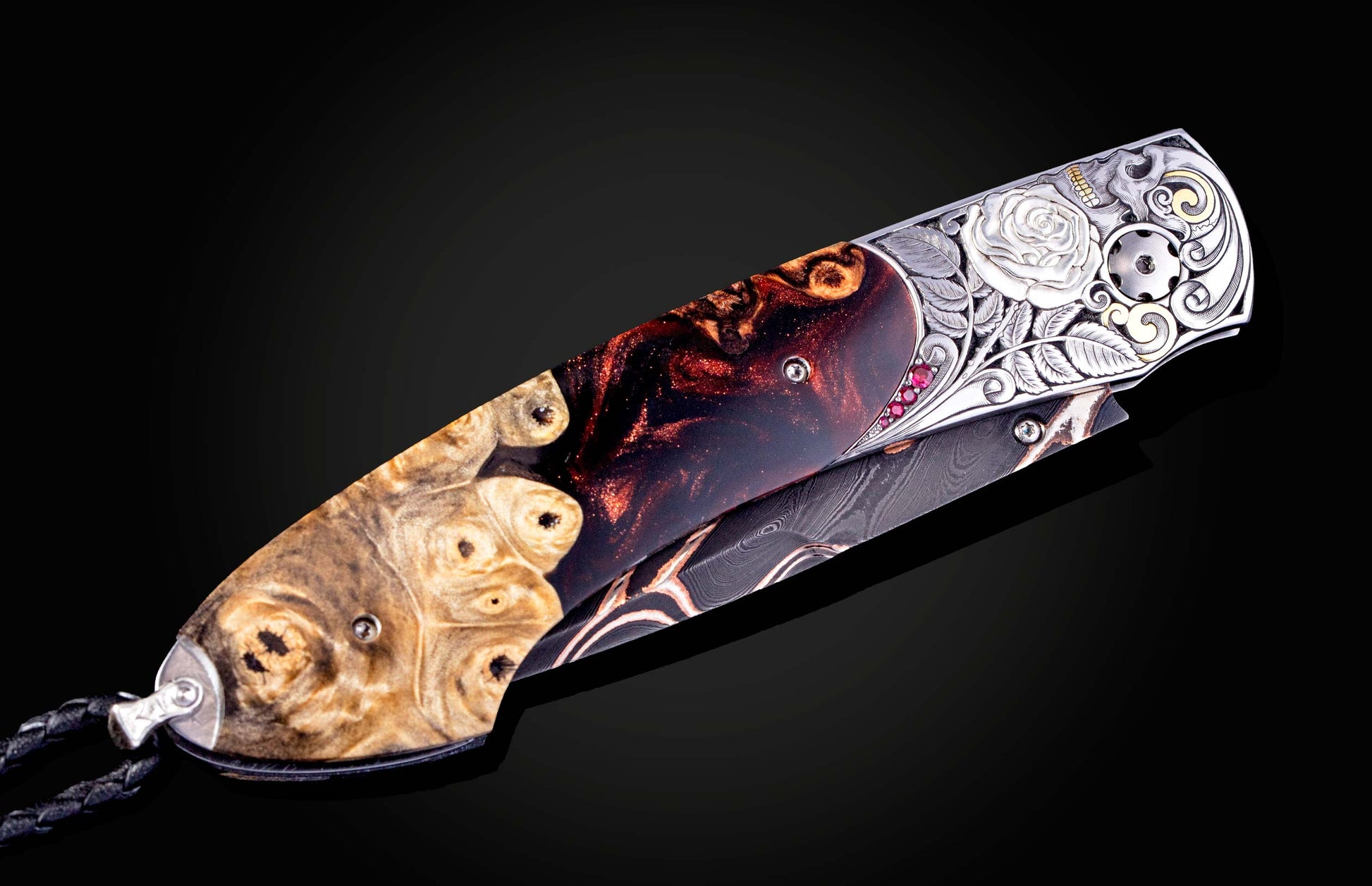 Decorative knife with artistic handle design on a black background