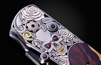 Decorative knife with artistic handle design on a black background