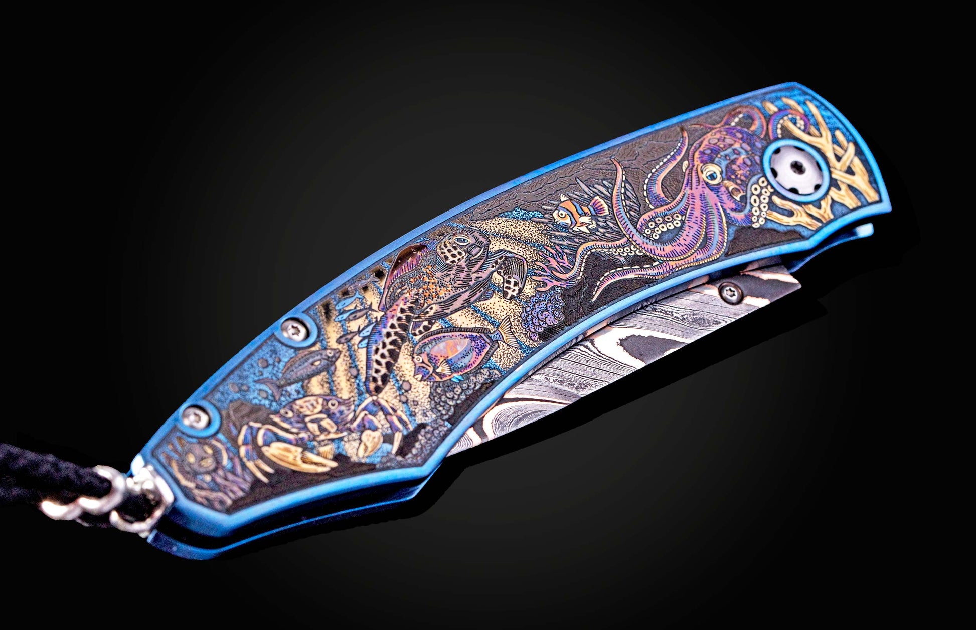 Color laser engraved William Henry Knife with damascus steel blade showing sea life