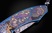 Color laser engraved William Henry Knife with damascus steel blade showing sea life