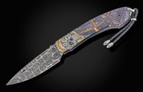 Decorative knife with a patterned handle on a black background