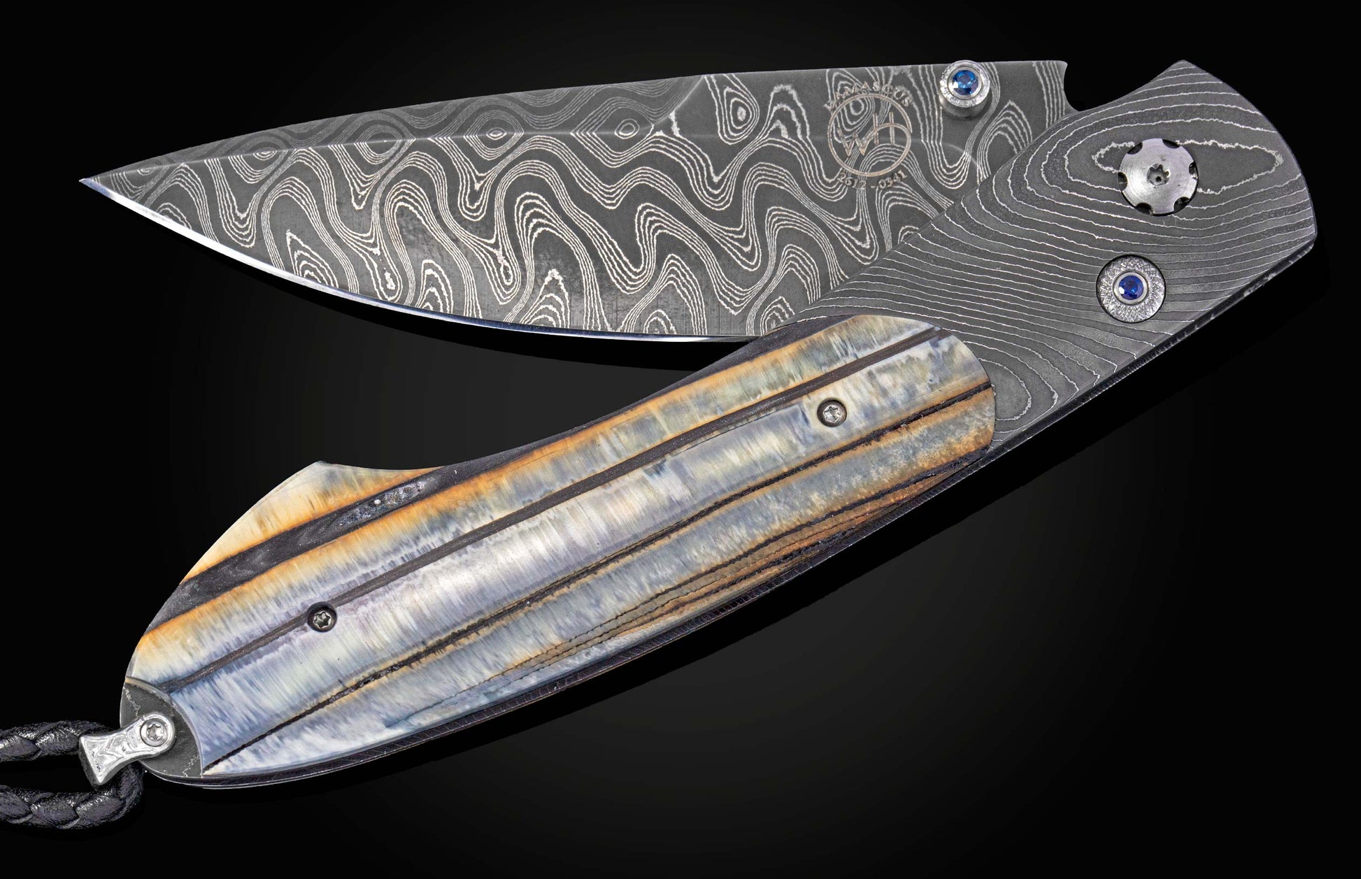 Folding knife with 10,000 year-old fossil Woolly Mammoth tooth and damascus blade on a black background shown slightly open