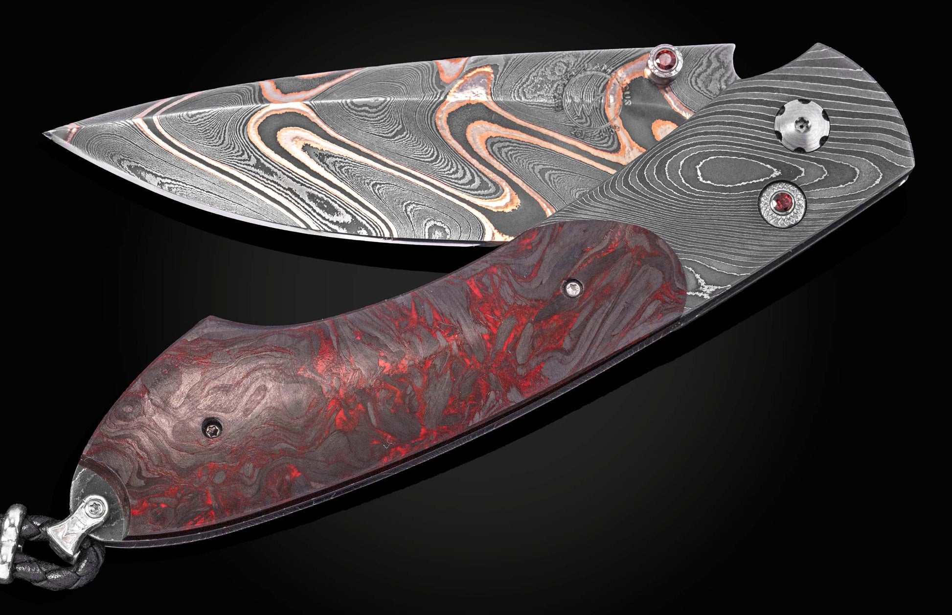 Folding knife with a patterned Damascus steel blade featuring copper swirls, a WH logo, and a red and black marbled handle with jeweled accents.