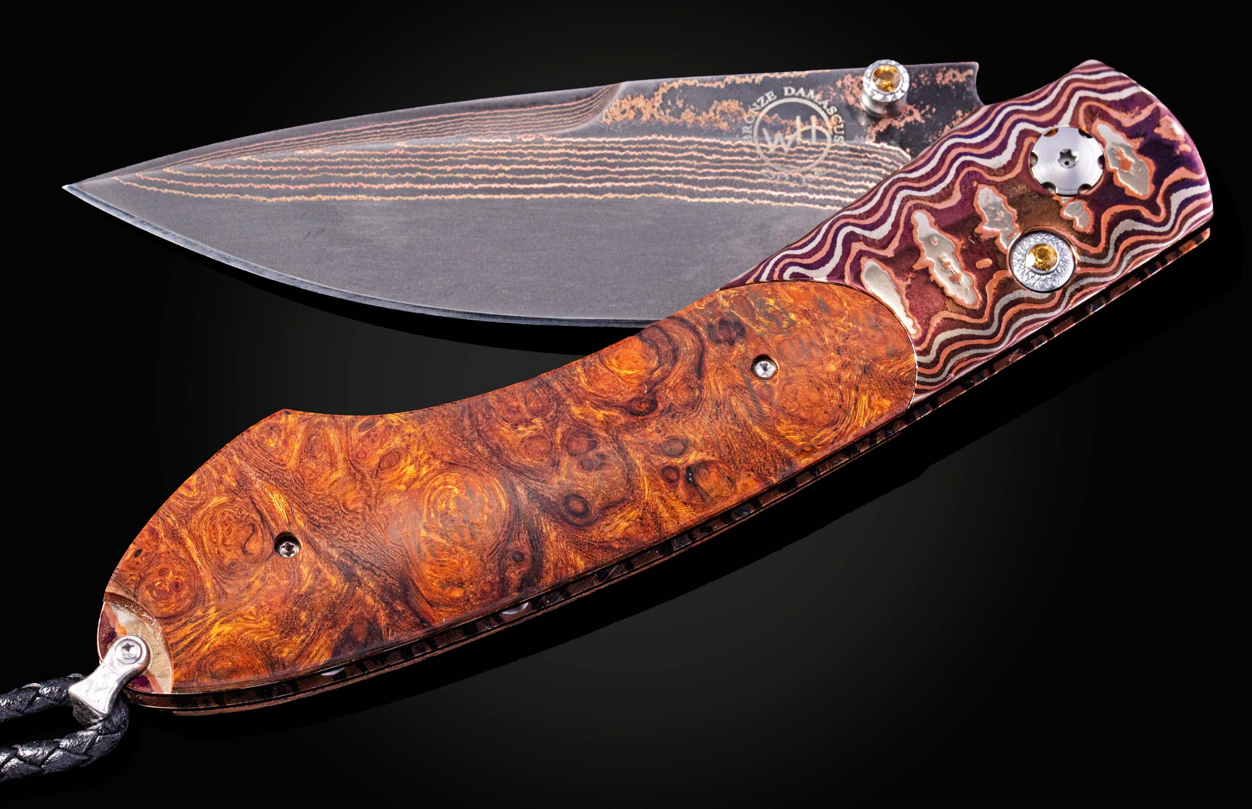 Folding knife with a decorative handle on a black background