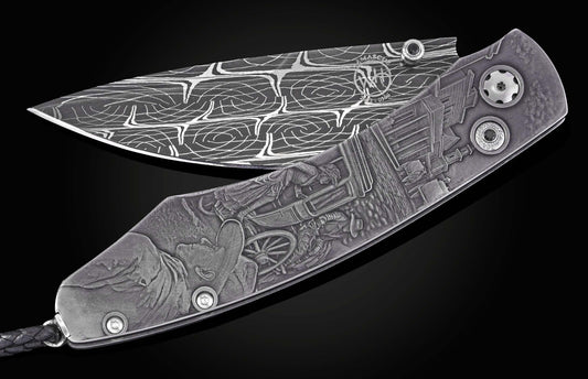 Metal folding knife with a swirling patterned Damascus blade marked 'WH' and an intricately engraved handle depicting an Old West town scene.