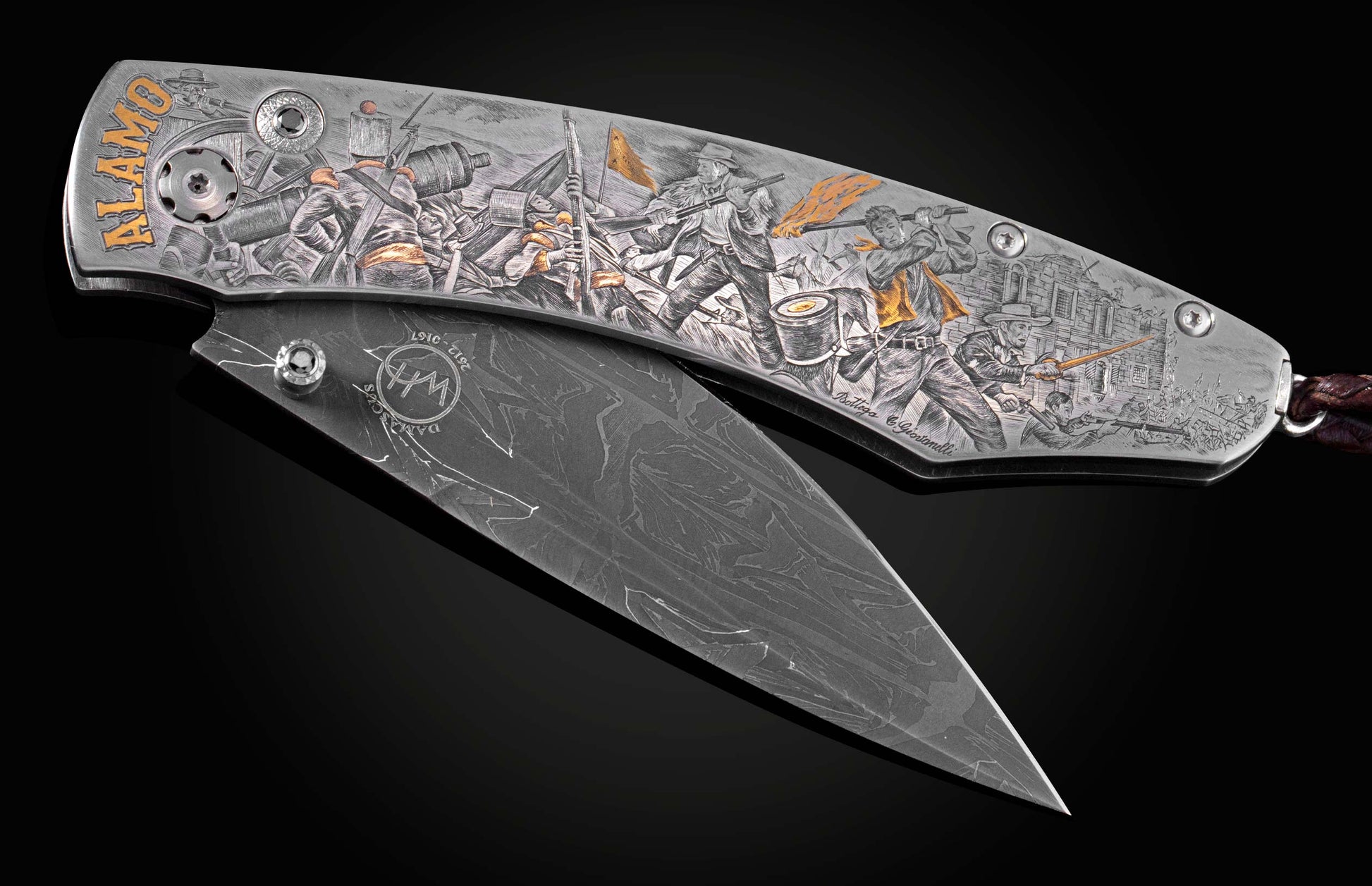 Decorative folding knife engraved with images from the Alamo on a black background