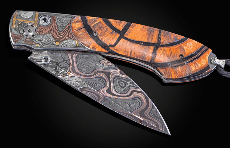 William Henry knife with woolly mammoth tusk, hand engraving, and damascus steel blade.