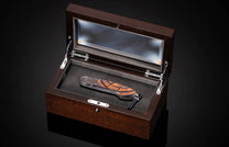 William Henry knife with woolly mammoth tusk, hand engraving, and damascus steel blade.