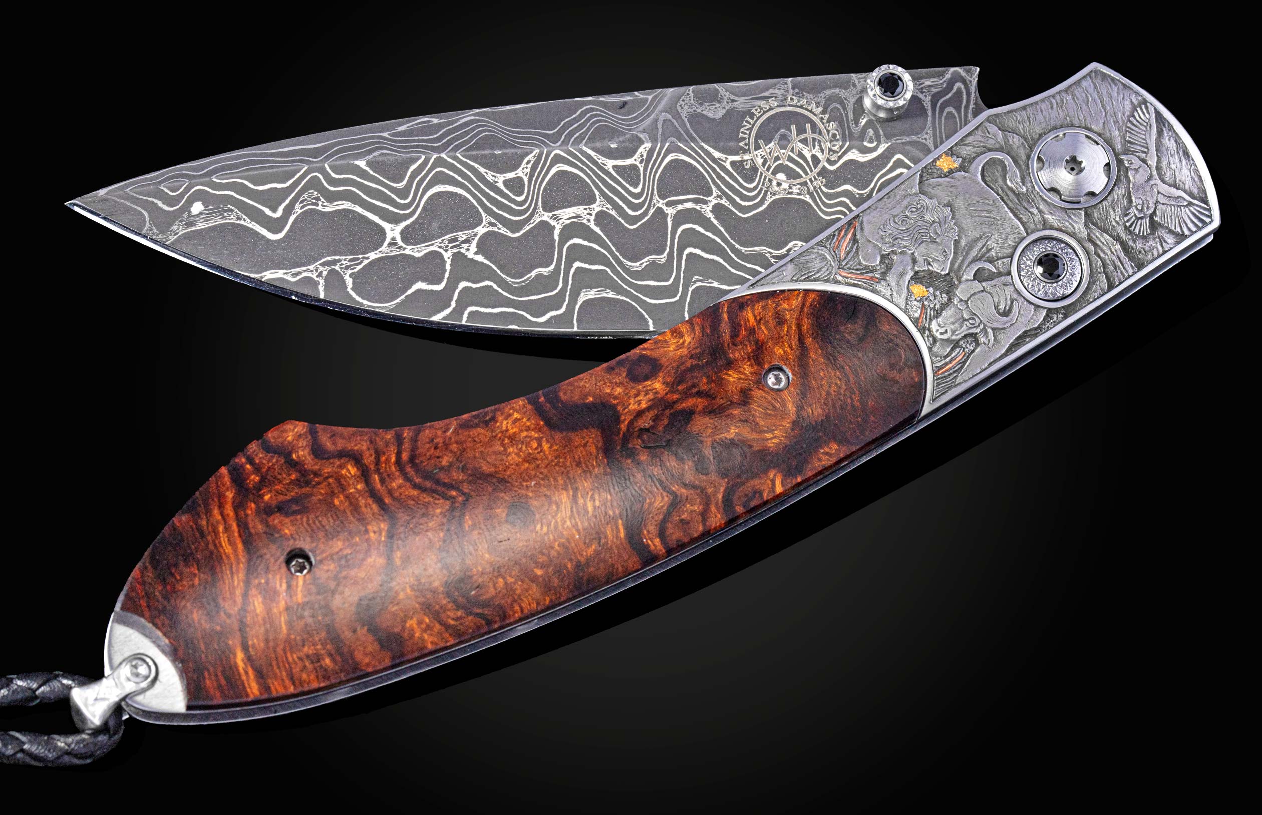 Folding knife with Damascus steel blade , hand engraving, and desert ironwood handle on a black background