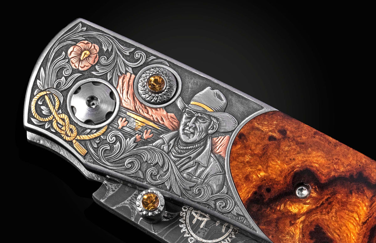 Luxury B12 Wrangler knife with intricate silver engraving, amber gemstones, and burl wood handle, side view detail
