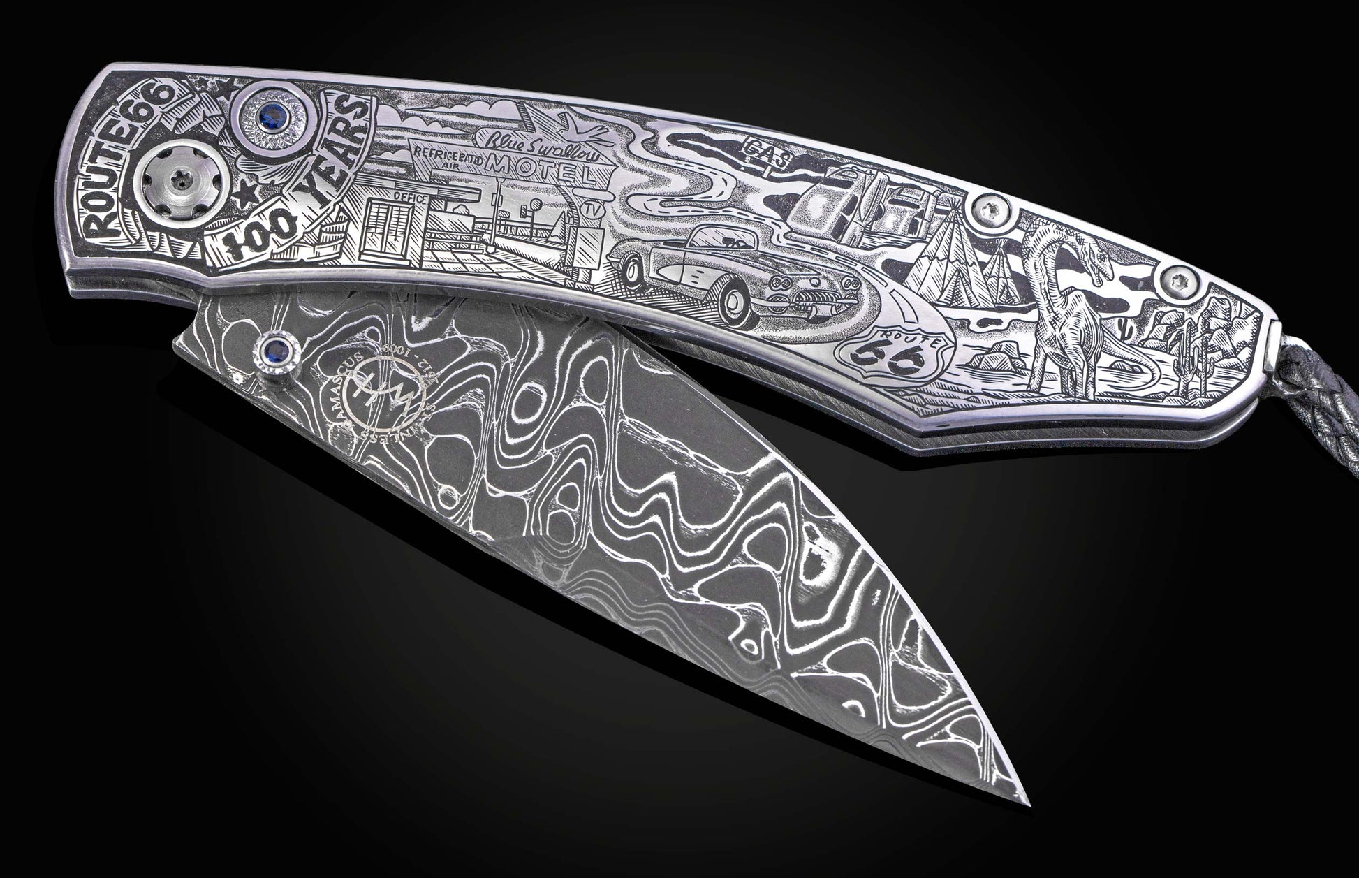 Hand engraved William Henry knife with depictions of Route 66 on a black background