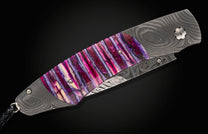 Damascus folding knife with vibrant purple inlay, Hope B12 design.