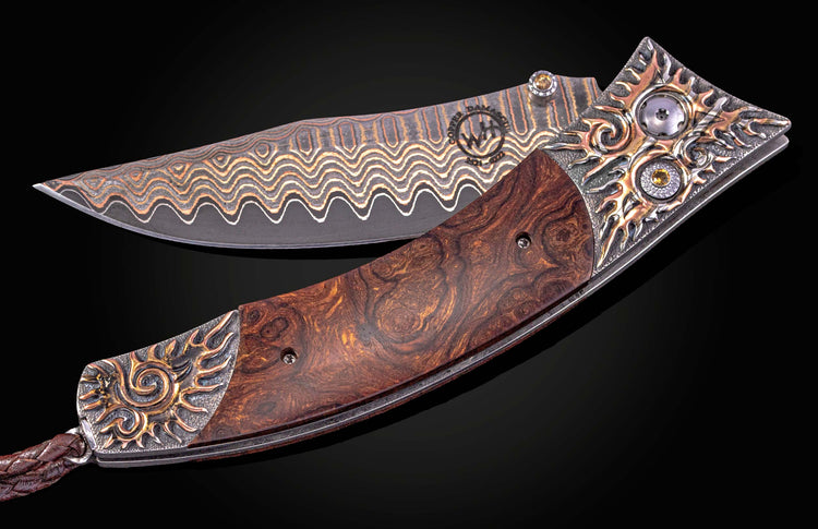 William Henry knife with hand-carved sterling silver, mokume gane, desert ironwood, and damascus steel blade