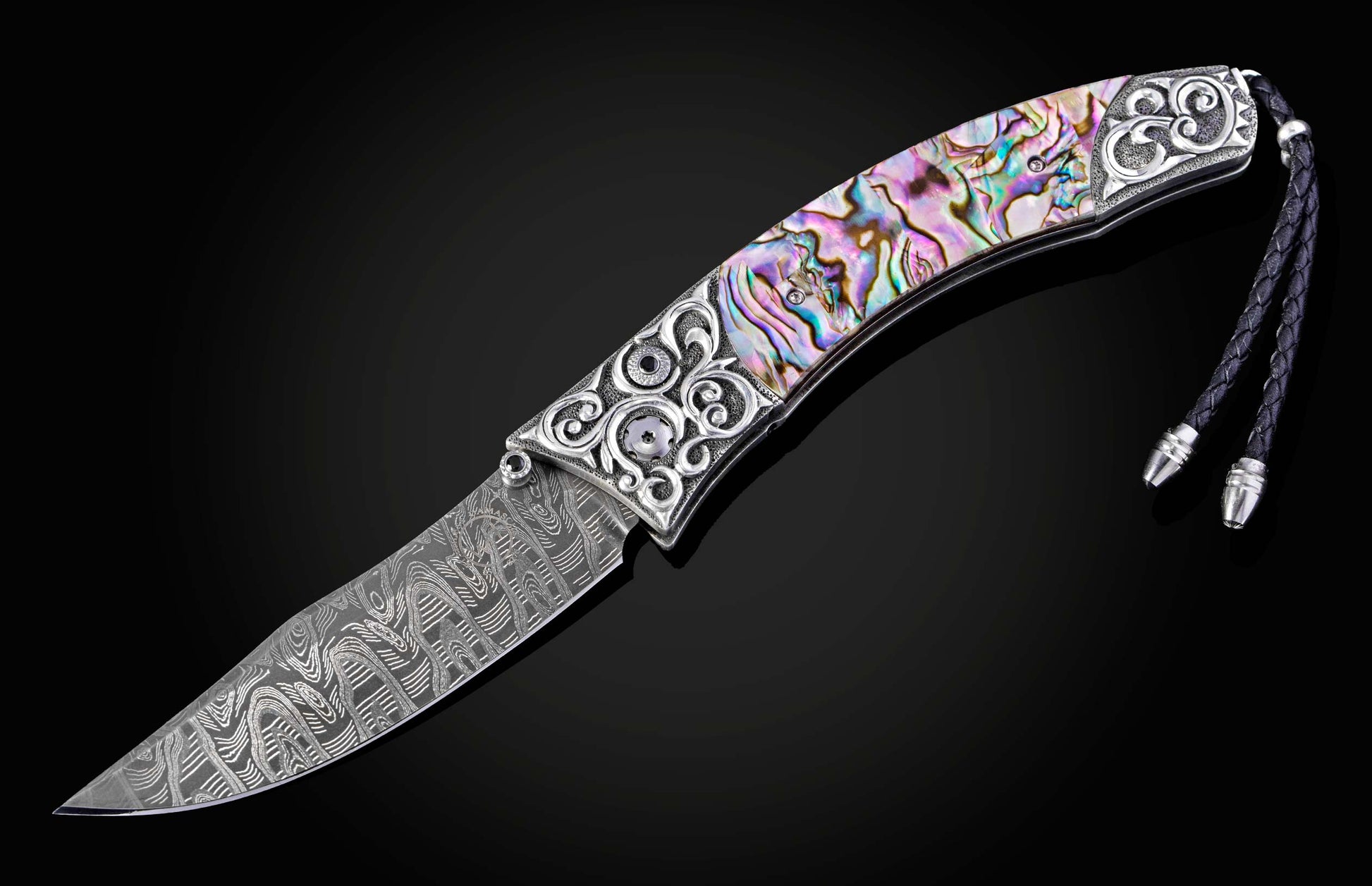 Decorative knife with a colorful handle on a black background