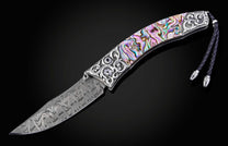 Decorative knife with a colorful handle on a black background