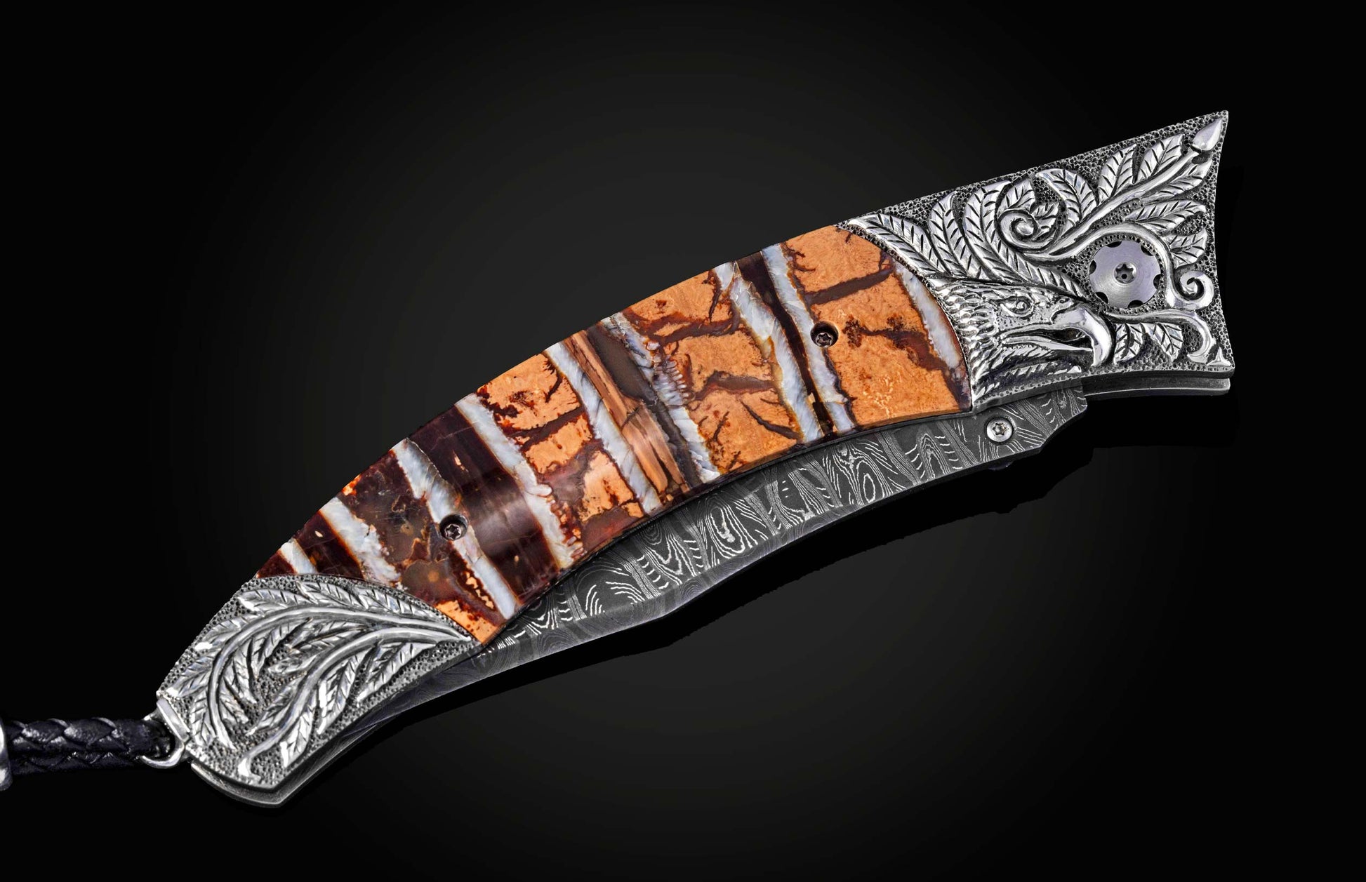 Decorative knife with an ornate handle on a black background