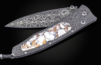 William Henry folding knife with damascus steel and white turquoise in bornze.