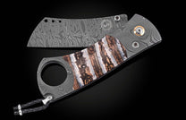 Damascus steel cigar cutter with marbled brown and white handle, by CG1 Heirloom, featuring intricate wave patterns and braided lanyard, side view on black background