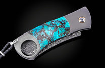 Turquoise stone inlay cigar cutter by CG1 Kingman, featuring brushed metal frame and damascus steel blade, side view on black background