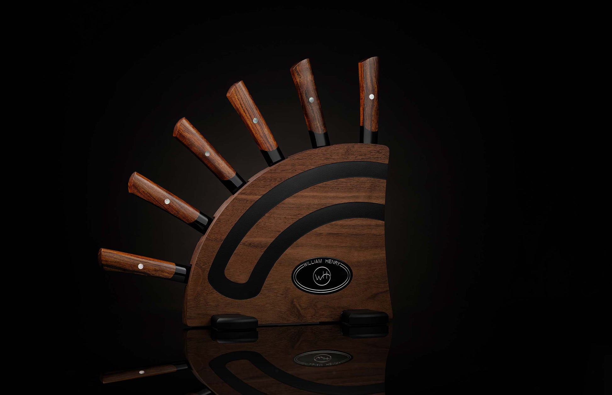  set of steak knives on a dark wooden block