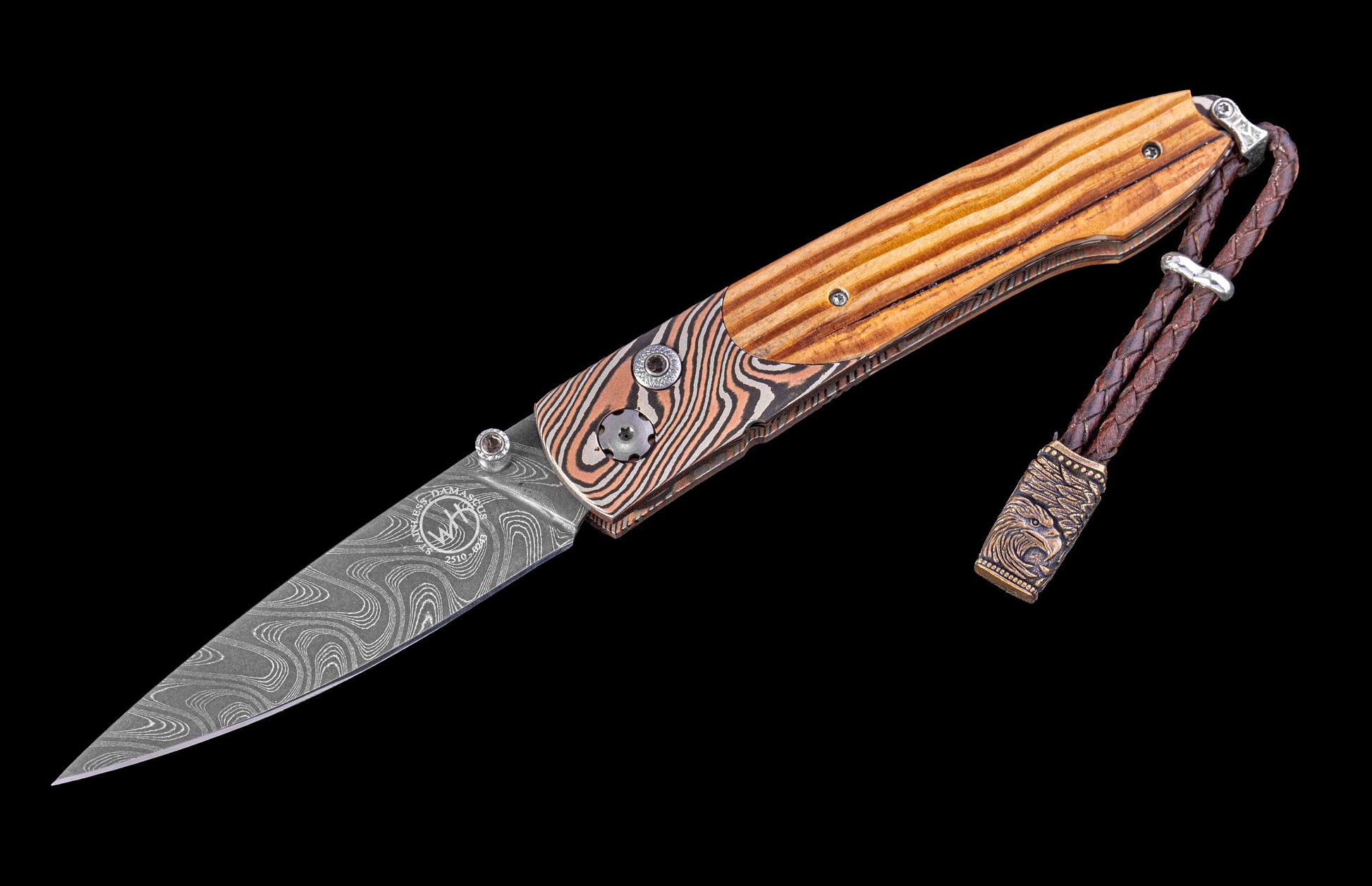 Pocket knife with wooden handle and damascus blade on a black background