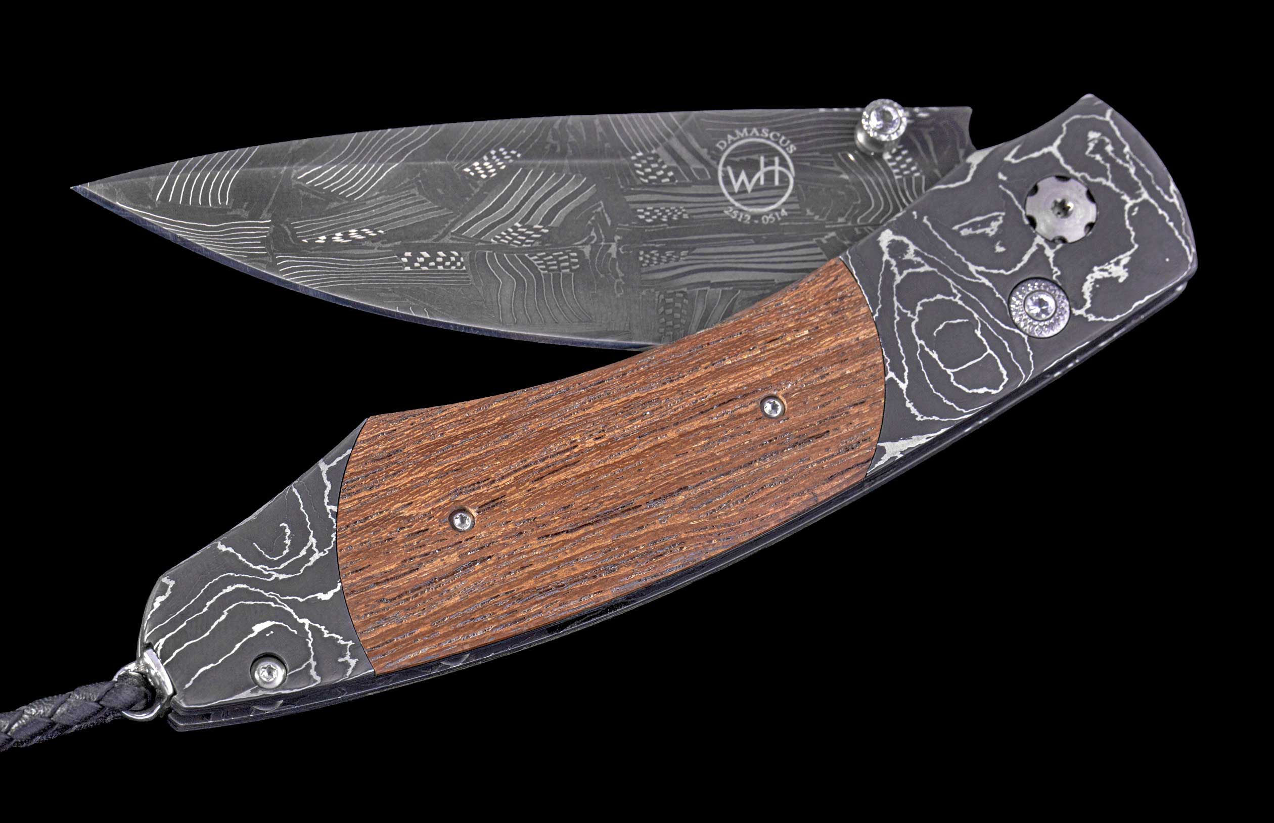 Foldable knife with wooden handle and engraved blade on a black background