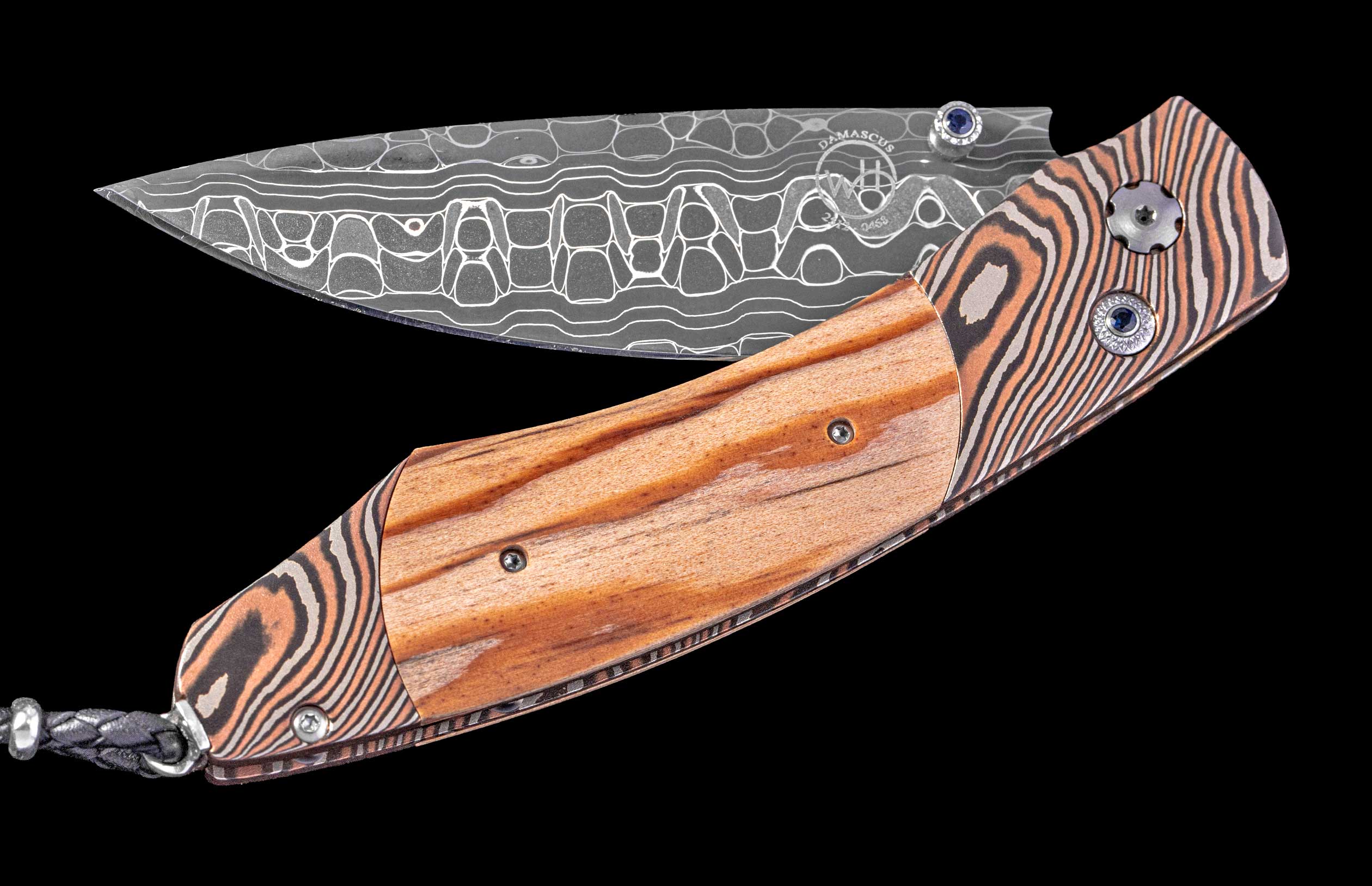 Knife with wooden handle and decorative blade on a black background