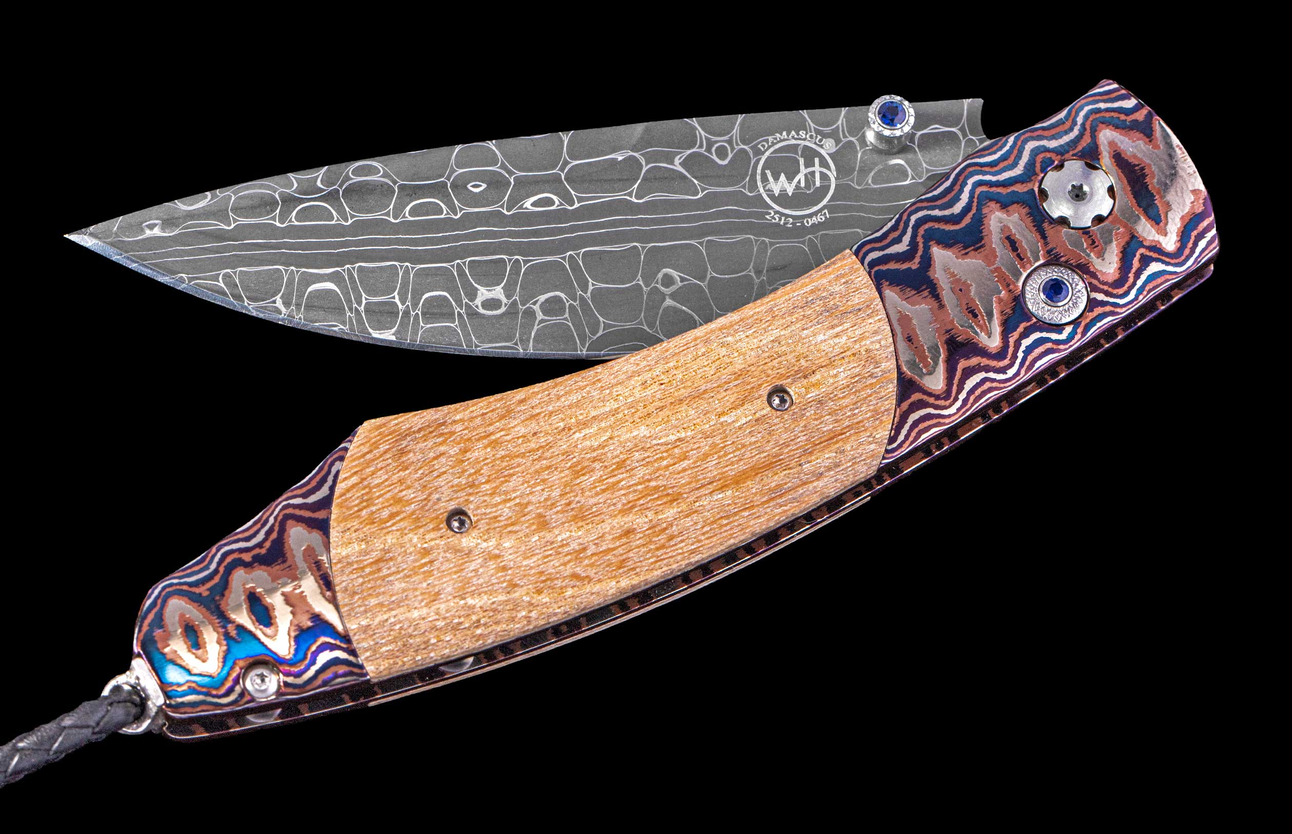 Folding knife with a decorative wooden handle and metal blade on a black background