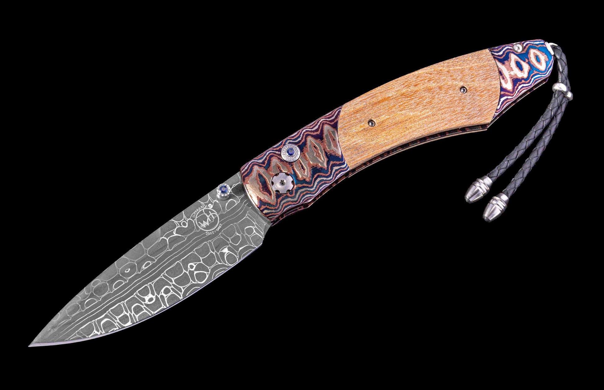 Folding knife with a decorative wooden handle and metal blade on a black background
