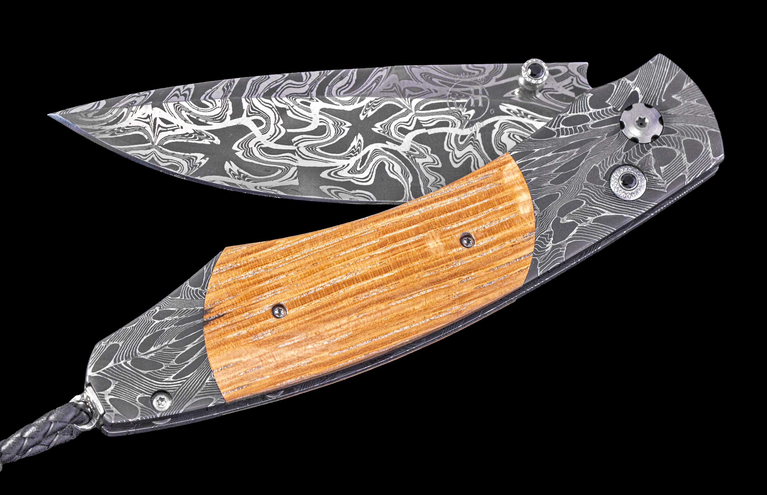 Folding knife with wooden handle and decorative blade on a black background