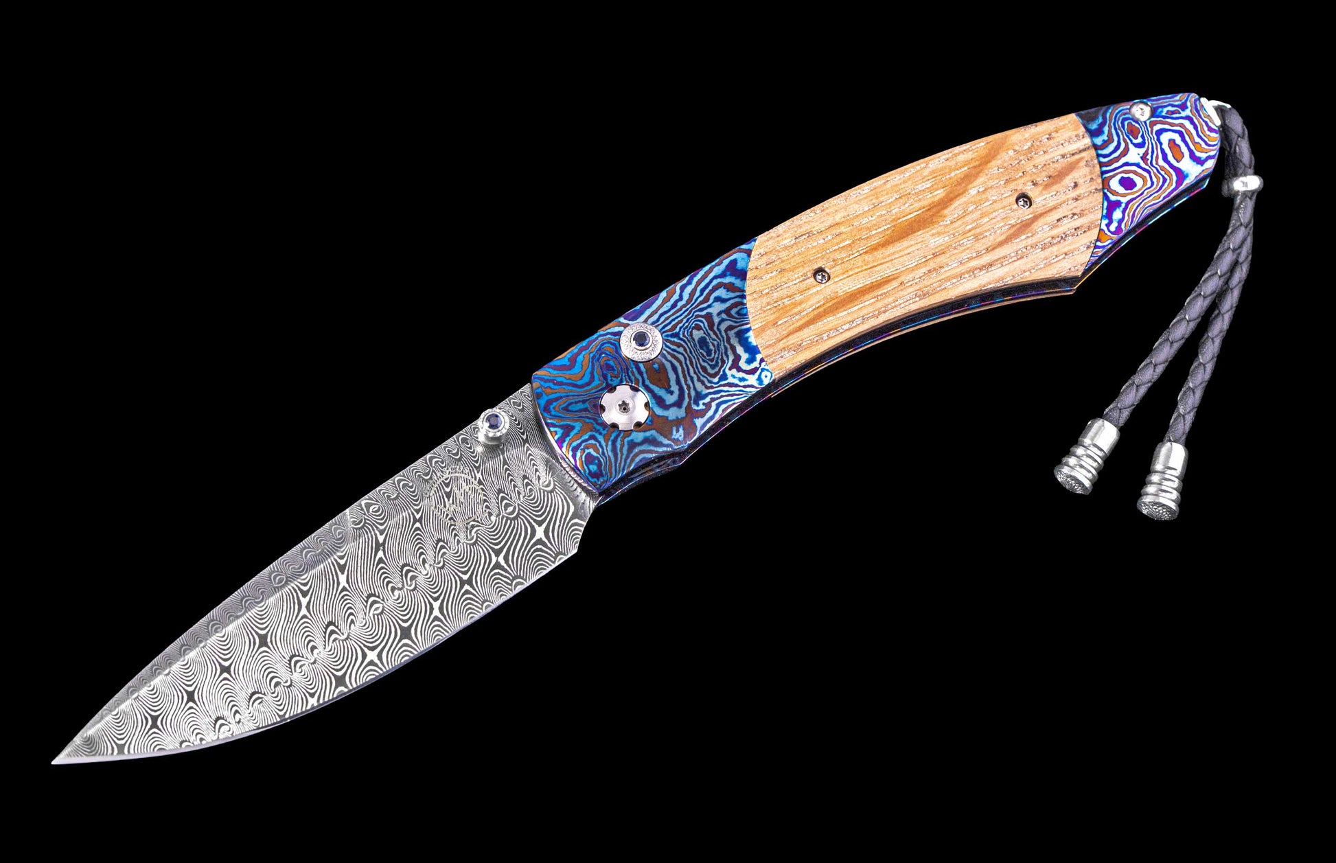 Folding knife with wooden handle and decorative blade on a black background
